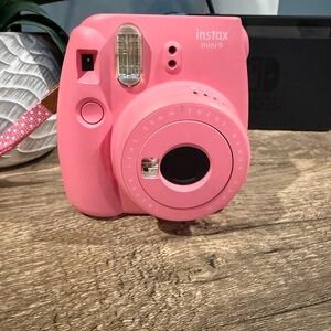 Fujifilm Instax Mini 9 instant film camera in the color Flamingo Pink